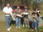 Cale, Todd, Michael, and Bryson Alligood, and Mac Cress, of Salisbury, NC, with some of the puppy drum and other fish they hooked on fresh shrimp while fishing the Cape Lookout surf.