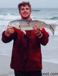 Brent Hinson, of Wilmington, with a 24" puppy drum that bit a Carolina-rigged mud minnow in the surf at Wrightsville Beach.