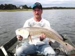 Bill Lamb with a 33" red drum that struck mullet near Wrightsville Beach while he was fishing with Butch Davis.