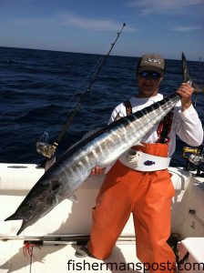 Capt. Cane Faircloth with a wahoo that attacked a red/black-skirted ballyhoo in the in 220' of water near the Same Ol' Hole while he was fishing with Capt. Kevin Sneed of Rigged and Ready Charters out of Holden Beach.