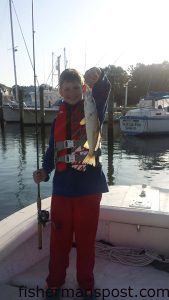 Scott with a gray trout that he hooked while casting to some docks near Beaufort with Capt. Chris Kimrey of Mount Maker Charters.