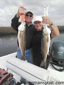 Fred and Jean Walker, from Pender County, with a pair of red drum that bit shrimp on jigheads in a creek near Bald Head Island. They were fishing with Capt. Jeff Wolfe of Seahawk Inshore Fishing Charters.