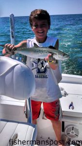 Blake Boyd with a 20" spanish mackerel that bit a diving plug just off Topsail Inlet while he was fishing with his dad and friends.