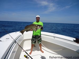 Matt Cox with a 23.2 lb. gag grouper that inhaled a 7 oz. Blue Water Candy Roscoe jig in 250' of water offshore of the 100/400 while he was fishing with    Mickey Gilley, Walker Isley, and Chase Henderson on the "SeaWalker."