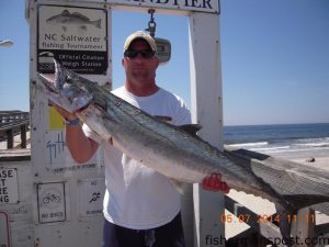 Steven Dombrowski with a 22.7 lb. king mackerel that bit a live bluefish off Oak Island Pier.