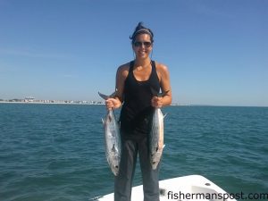 June Salvati, of Wilmington, with a pair of Atlantic bonito she hooked off Kure Beach while working a Gotcha plug.