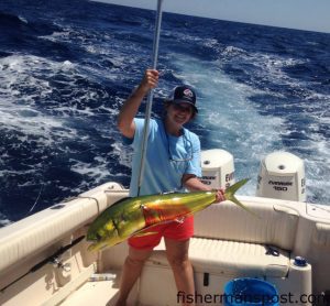 Lindsey Dober with a dolphin that she hooked while trolling near the Same Ol' Hole with Jon Wood and her father Bruce.