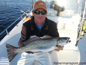 Dak Millis, of Wilmington, with a healthy speckled trout that struck a Rapala X-Rap in the Cape Fear River while he was fishing with Capt. Jamie Rushing of Seagate Charters.