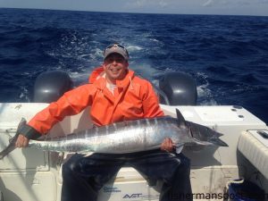 Tanner Gray with a 54 lb. wahoo that struck a black/purple Cowbell lure while he was high-speed trolling in 140' of water near the Swansboro Hole with Taylor Perdue on the "Reel Return."