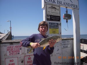 Jamie Lutz, of Oak Island, with a 4.2 lb. jack crevalle that bit a Gotcha plug off Oak Island Pier.