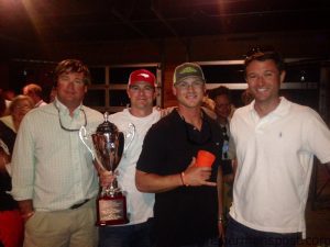 Drew Logan, Mitch and Zack Taylor, and John Henry--the "Cat Baby" crew, with the Dylan Price Cup they earned for scaling 83.9 lbs. of gaffer dolphin and wahoo on their way to victory in the 6th Annual Reelin' For Research tournament. The hooked their fish while trolling skirted ballyhoo around the 300 line south of Beaufort Inlet.