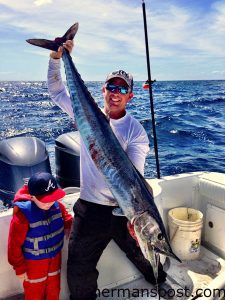 Brayden and Capt. Barrett McMullan, of the Ocean Isle Fishing Center, with a wahoo they hooked while trolling the break off Ocean Isle Beach.