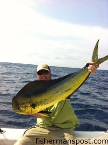 Gary Walker with a dolphin that struck a ballyhoo 40 miles off Carolina Beach Inlet while he was fishing on the "Jenny Lee."