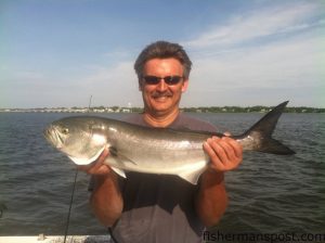 Dennis Turpin, of Bedford, VA, with an 8 lb. bluefish that bit a Carolina-rigged mullet around an oyster bar in the White Oak River while he was fishing with Capt. Rob Koraly of Sandbar Safari Charters.