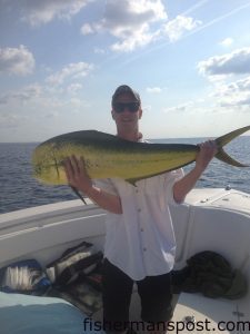 Tavis McFayden, of Wilmington, with a dolphin that he hooked while trolling near the Blackjack Hole with Billy Goss on the "Wahooligans."