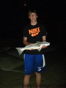 Davis Fray, of Whitehouse, OH, with a 25" puppy drum that bit shrimp in the Buxton surf.