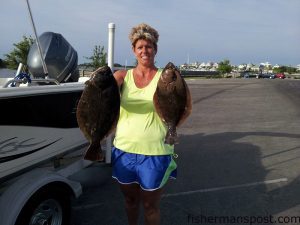 Olivia Nagy with a 24" and 20" flounder that bit live menhaden near Carolina Beach while she was fishing with her husband Tim.