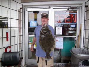 Leonard Lewis, of Southport, NC, with a 7.68 lb. flounder he hooked near Southport. Weighed in at Wildlife Bait and Tackle.