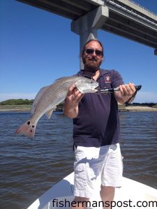 Joe Veltri, of Bully's Pub in North Myrtle Beach, with a red drum that bit a live mud minnow on a Mission Fishin jighead while he was fishing with Capt. Mark Dickson of Shallow Minded Inshore Fishing Charters.