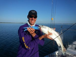 Lee Padrick with a red drum that bit a Salty Bay Baits Red Devil while he was fishing some shallow water on the Crystal Coast with Dwayne Smith.