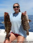 Claire Dufour with her first yellowmouth and snowy groupers, hooked on squid while she was bottom fishing in 480' of water off Cape Lookout with her father Jaques and brother Jacky Dufour on the "Merry Marlin."