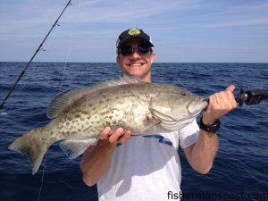 Warren Phillips, of Wrightsville Beach, with a gag grouper he hooked on squid at some bottom structure 25 miles off Wrightsville Beach while he was fishing with his father and Johnny Burke on the "Prime Time."