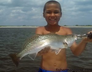 Gage Henley, of West Bergen, NJ, with a 4 lb. speckled trout that bit a Carolina-rigged finger mullet near Masonboro Inlet while he was fishing with Capt. Mike Pedersen of No Excuses Charters.