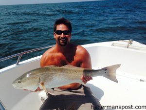 Travis Ackerman with an over-slot red drum he caught and released at Yaupon Reef after it fell for a live finger mullet.