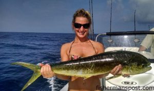 Caitlin Nugent, of Raleigh, NC, with her first dolphin. The fish fell for a ballyhoo behind a blue/white sea witch near the Rockpile.