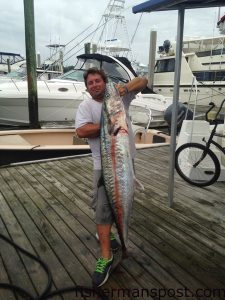 Capt. Tommy Berry with a fat cobia he hooked on a live crab after casting a host of other artificials and live baits to it. He was fishing solo off North Topsail Beach.