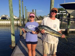 Carolina and Will Newcomb with a 4 lb. spanish mackerel and a gaffer dolphin that bit live baits 16 miles off New Topsail Inlet while they were fishing on the "Ditch Digger."