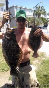 Britt Williams with 17" and 7.6 lb. flounder that bit Britts Bucktails with soft plastic trailers in an Ocean Ilsle Beach canal.