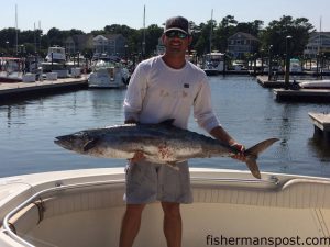 Travis Overman,of Southport, with a 42 lb. king mackerel that bit a live bait near Frying Pan Tower while he was fishing with Tommy and Tom Rechichar. 