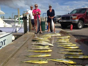 Charlotte and Sarah Rollason with wahoo, a yellowfin tuna, and plenty of dolphin they hooked while trolling offshore of Hatteras Inlet on the charterboat "Patriot" out of Hatteras Harbor Marina.