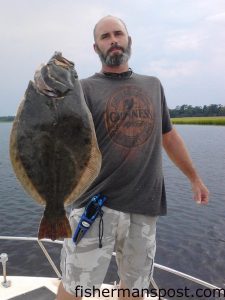 Jamie Spell, of Fayetteville, NC, with a 6.6 lb. flounder that bit a live mullet near Southport while he was fishing with Tim Lee on the "Second Cast."