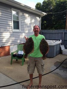 Joe Gregorinci, of Willow Springs, NC, with a pair of flounder that bit Gulp baits while he was fishign the Southport waterfront.