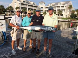 Bob Crandall, Jude Panetta (angler), Bryant Wales, and Capt. Phil Mosely with a 66" wahoo they landed while trolling near the Blackjack Hole on the "Yellow Rose." A blue/pink/white-skirted ballyhoo was too much for the 'hoo to resist.