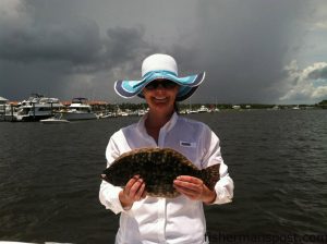 Dallas Vestal, of Siler City, NC, with a 17.5" flounder that struck a spinnerbait in Carolina Beach Inlet.