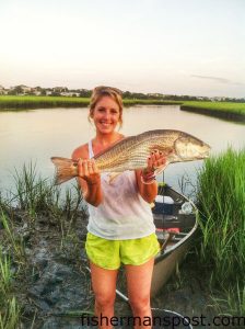 Kelsey Claiborne, of Wilmington, with her first topwater fish, a 28" red drum that struck a Rapala Skitterwalk inshore of Wrightsville Beach while she was fishing with Brent Hinson.