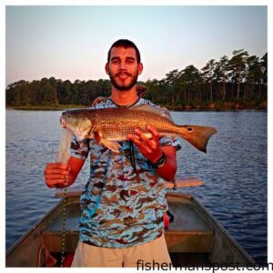 Matthew Merriman, of Jacksonville, with a 23" re ddrum that bit a spoon in the New River south of Jacksonville.