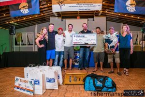 The crew of the "Uno Mas" with their winnings from the Pirate's Cove Big Game Tournament. The anglers release nine white marlin and two sailfish to amass 770 points and take the win. Photo by Matt Lusk.