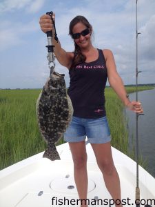 Stephanie Hall, of Lexington, SC, with a flounder that struck a Carolina-rigged finger mullet while she was fishing in Tubbs Inlet with Capt. Mark Dickson of Shallow Minded Inshore Fishing Charters.