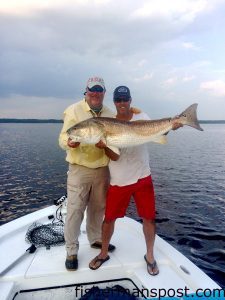 tide_dubielCapt. Gary Dubiel, of Spec Fever Guide Service, helps Publisher Gary Hurley pose with his first citation red drum of the 2014 season. They were using DOA CAL jerkshads under DOA popping corks in a body of water near South River.