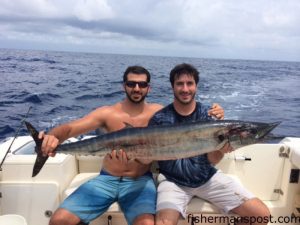 Scott and Ryan Brevda, of Greensboro, NC, with a 26 lb. wahoo they hooked on a chartreuse/white-skirted ballyhoo while trolling off Beaufort Inlet near the NE Big Rock.