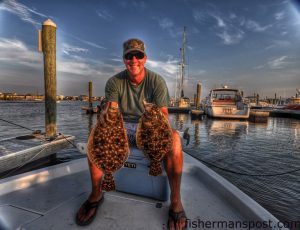 Scott Hampton, of Wilmington, with a pair of flounder he hooked on live baits in the Cape Fear River.