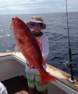 Cole Argay with his first red snapper, hooked on squid while he was bottom fishing off Wrightsville Beach.