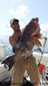 Mike Rhein with a 26 lb. red grouper that fell for a vertical jig at some bottom structure 40 miles off Masonboro Inlet while he was fishing with Warren Barton on the "Rockhound."