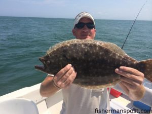 James McDuffie, of Bahama, NC, with a 25" flounder that bit a Gulp bait in Bogue Sound.