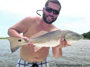 Kyle Underwood, of Tar Heel, NC, with a 24" red drum he hooked in the ICW near Southport.