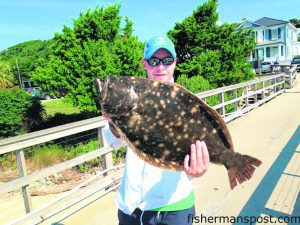 Jeff Sudbury, of Jasper, IN, with a 7.74 lb. flounder that struck a live finger mullet under the Southport City Pier. 